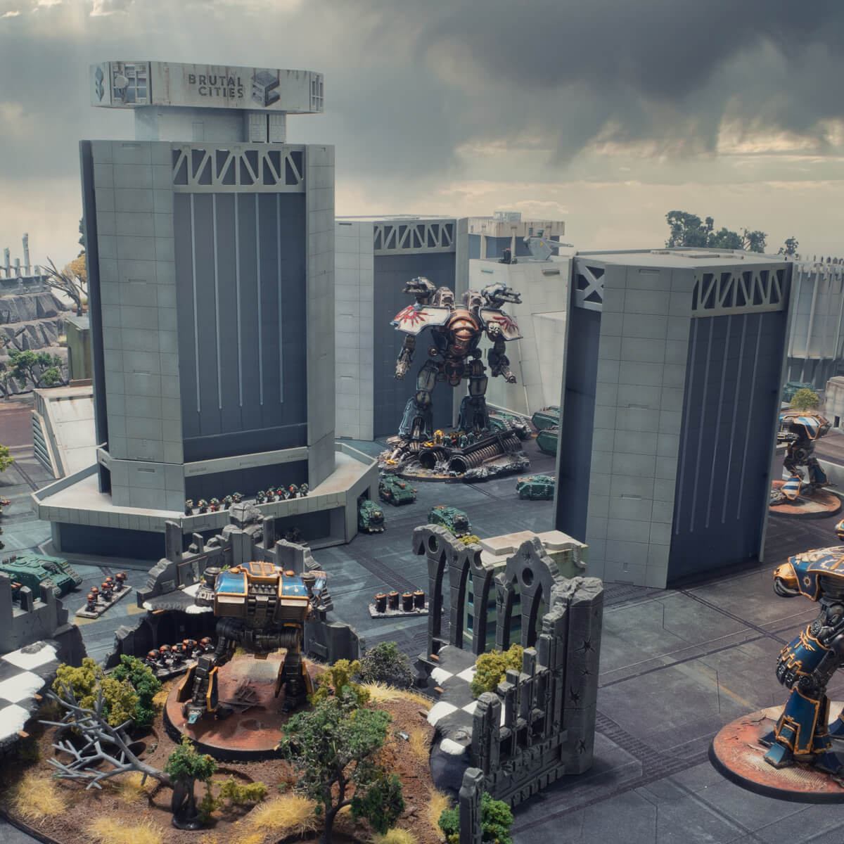 Large Epic 40k / Legions Imperialis brutalist skyscrapers with titans and space marines for scale. A gothic ruin building is in the foreground and a stormy sky in the background.
