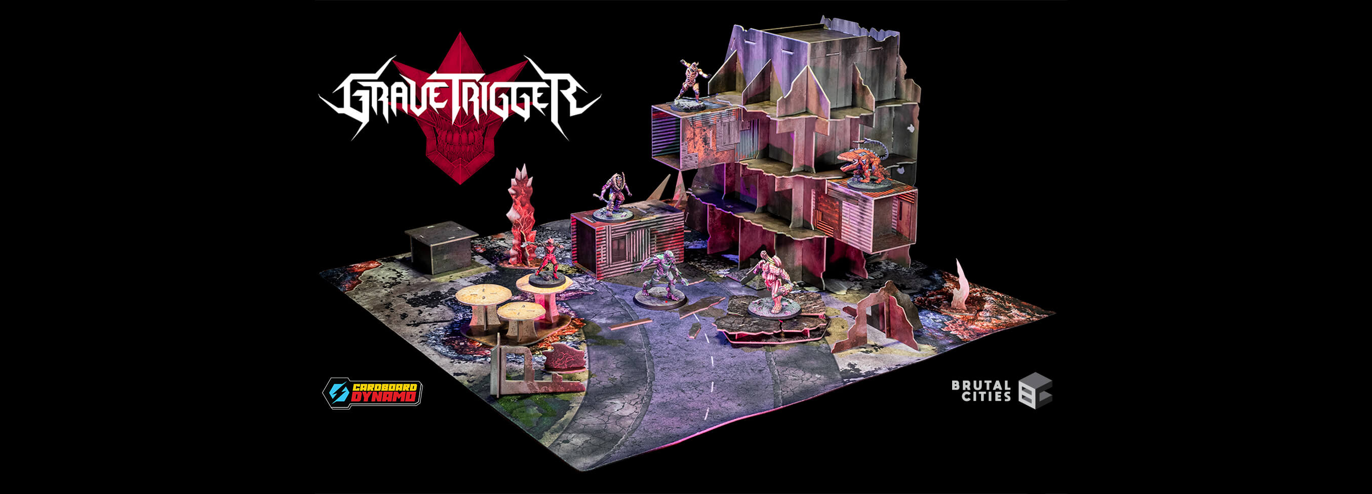 A miniature tabletop gaming terrain set for 'Grave Trigger' featuring a detailed multi-level ruined building, combat play map, and various mutant 32mm miniatures displayed on a black background with the Grave trigger, Cardboard Dynamo and Brutal Cities logos