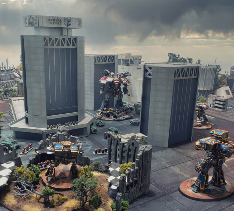 Large Epic 40k / Legions Imperialis brutalist skyscrapers with titans and space marines for scale. A gothic ruin building is in the foreground and a stormy sky in the background.