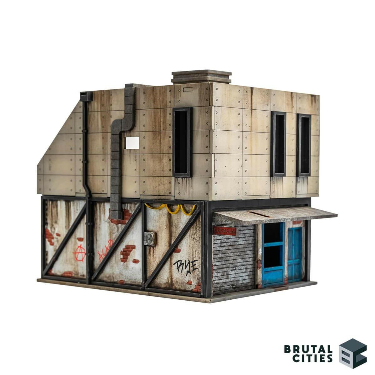 28mm terrain showing a Brutalist renovation on top of a delapidated brick shop